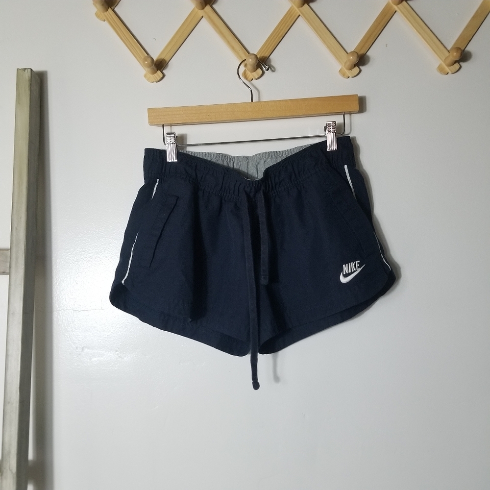 NIKE WOMEN'S NAVY AND WHITE SHORTS SIZE MEDIUM